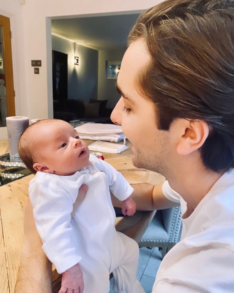  Sammy Kimmence cooing over their son as they relaxed together in the kitchen