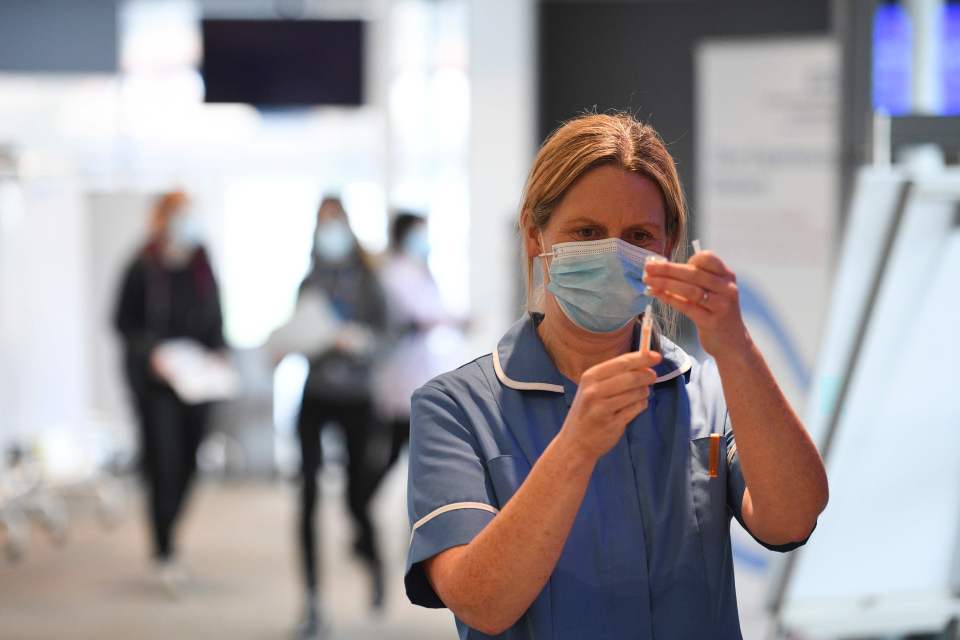 A medic prepares a dose of the Covid vaccine at Chester Racecourse, Chester