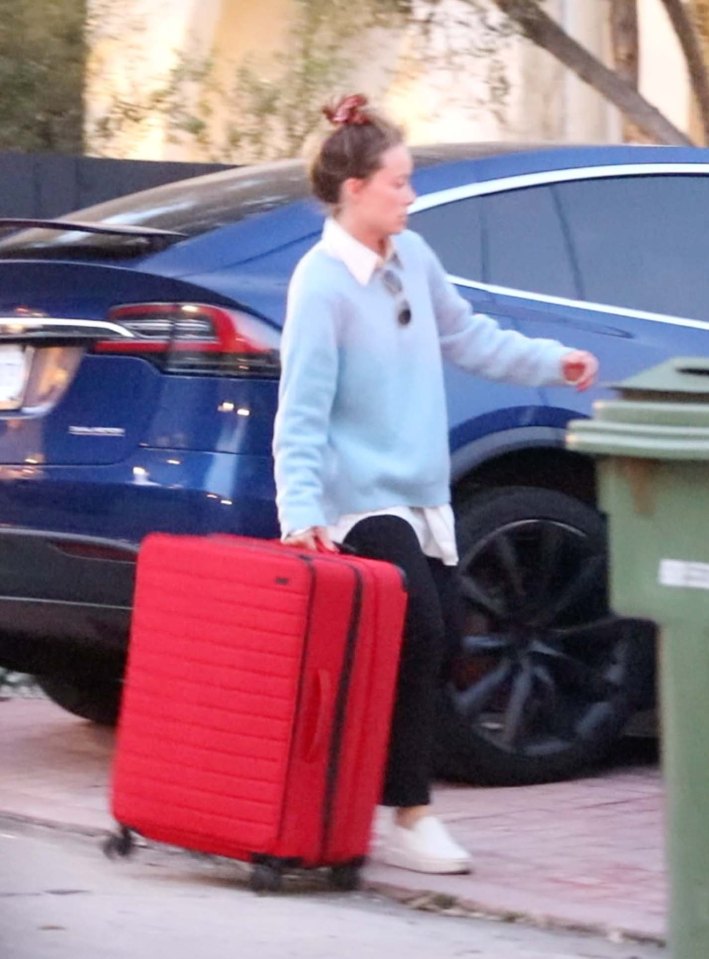 The US actress spent Valentine’s Day lugging suitcases from the LA house she shared with Hollywood star Jason Sudeikis, father of her two young children