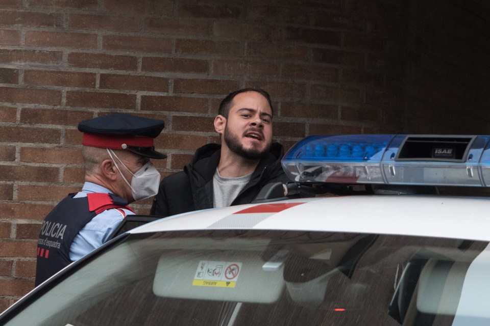 Pablo Hasel yells to TV cameras as he is arrested on Tuesday morning