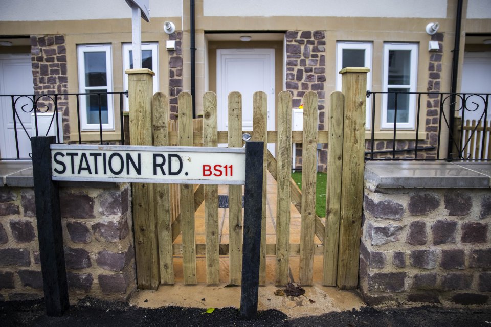 The sign in Bristol blocks more than half of the gate to the new build property