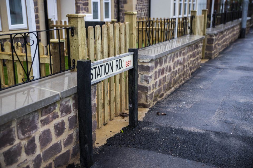 Bungling developers built the entrance to a home behind an existing road sign