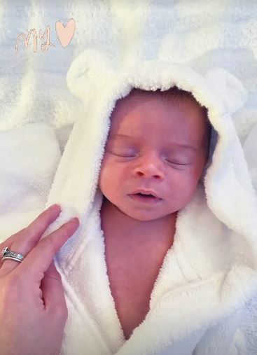 Dani Dyer's heart is melted after sharing sweet snap of Santiago in a fluffy robe