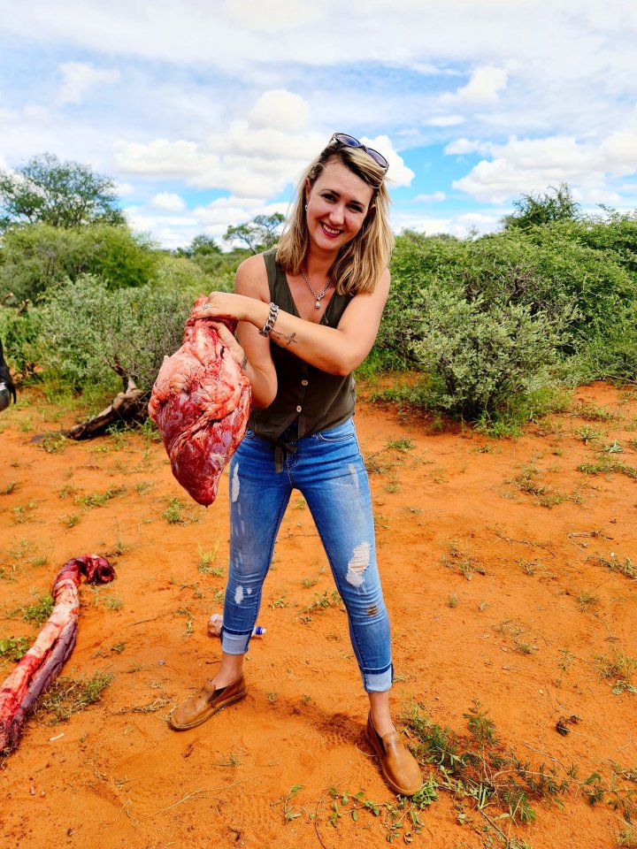 Merelize Van Der Merwe took snaps with a bloody giraffe heart and shared them online