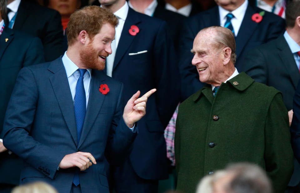 Prince Harry is seen here joking with his grandfather Prince Philip, who has been taken to hospital this week