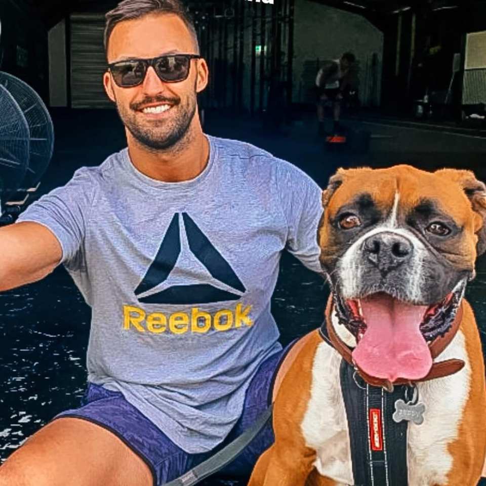 The electrician enjoys spending time with his cute boxer dog Buddy