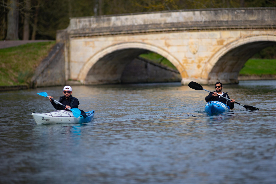 Two kayakers soak up the sun in Cambridge