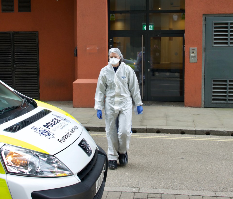 White-suited forensics officers were seen entering and leaving the block as they searched for clues today