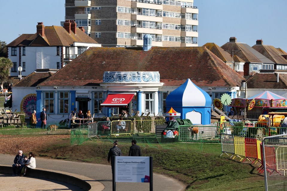 The DJ was seen chatting to customers at the takeaway till from behind a screen as a queue of people waited in the sunny weather