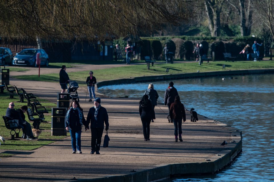 People walk along the water in Stratford-upon-Avon