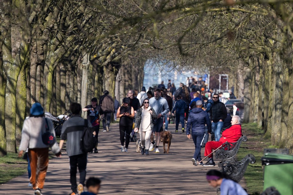 Crowds attempt to keep out of each others way while out for exercise in Greenwich Park in London