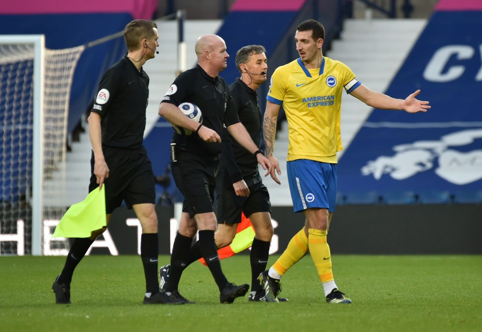 Lewis Dunk speaks to Lee Mason after his hugely controversial decision