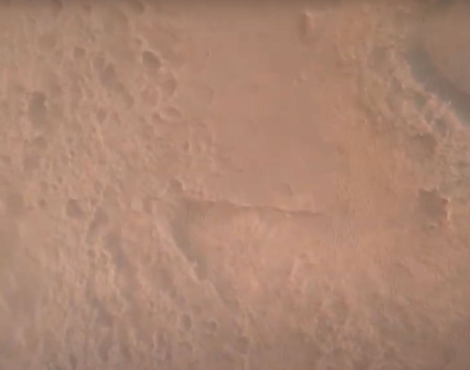 A first look at the dusty surface of the Red Planet as the rover plunged through the Martian atmosphere