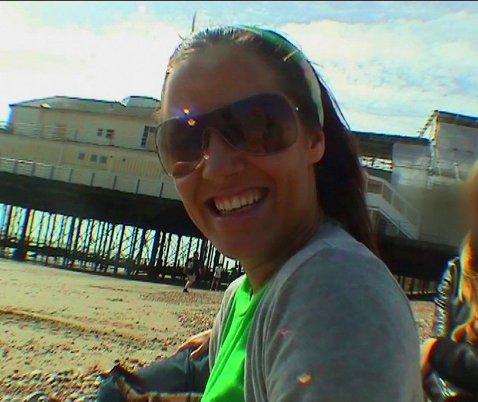 She is also shown in happier times, messing about on a beach in the UK