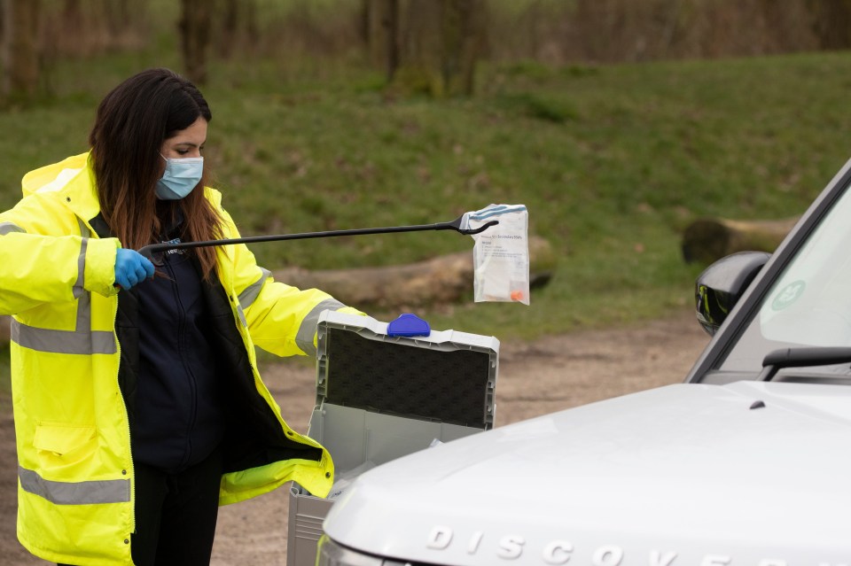 Patients make their way through the drive through section of a Covid-19 test site in Brentwood, Essex