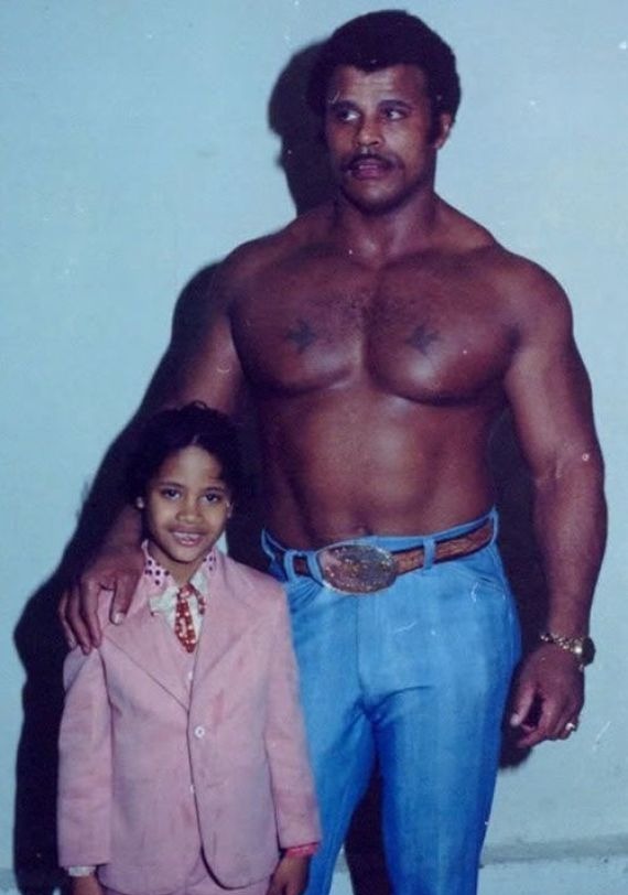 A young Dwayne Johnson with his World Wrestling Federation champ dad Rocky