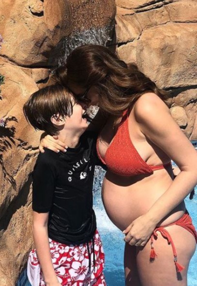 Stacey messing around with son Zachary while pregnant with third son Rex