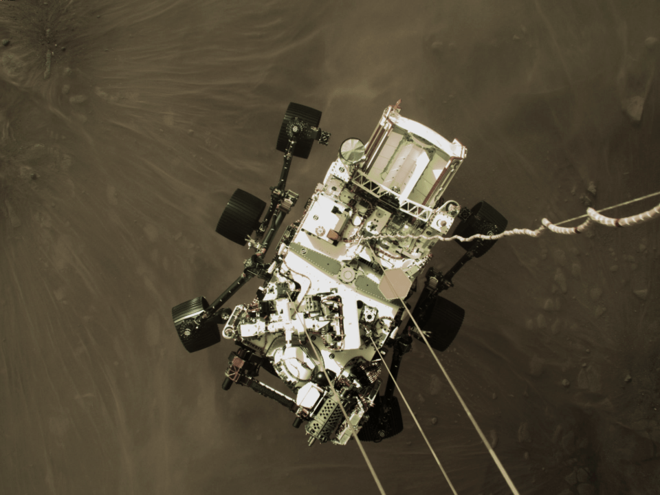 Birds-eye view of Nasa's Perseverance rover as its lowered to the surface of Mars by a spacecraft that assisted with the landing