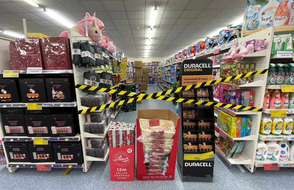 Shopping aisles selling non-essential items have been cordoned off until today