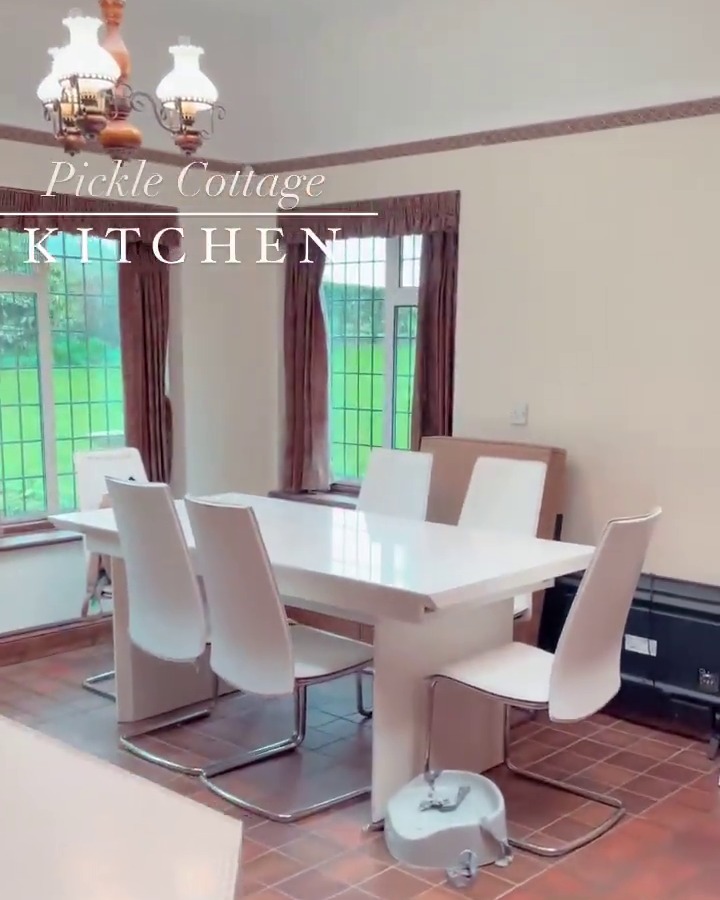 The eating area is now home to a set of very modern gleaming white table and chairs