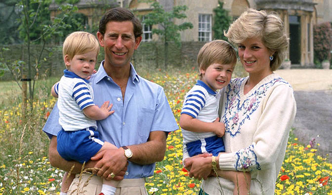 Prince Charles cuddling Prince Harry and Princess Diana with William