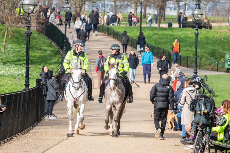 Mounted police patrolled Hyde Park in London yesterday as Brits made the most of the sunny weather