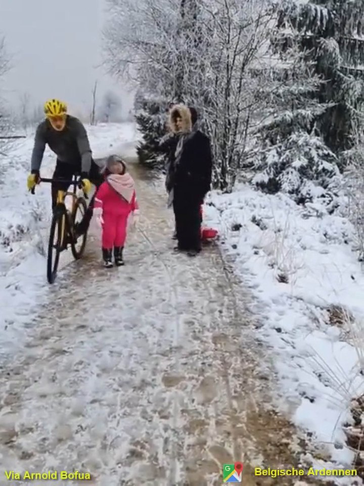 The cyclist appeared to stick out his knee as he rode past in the snow