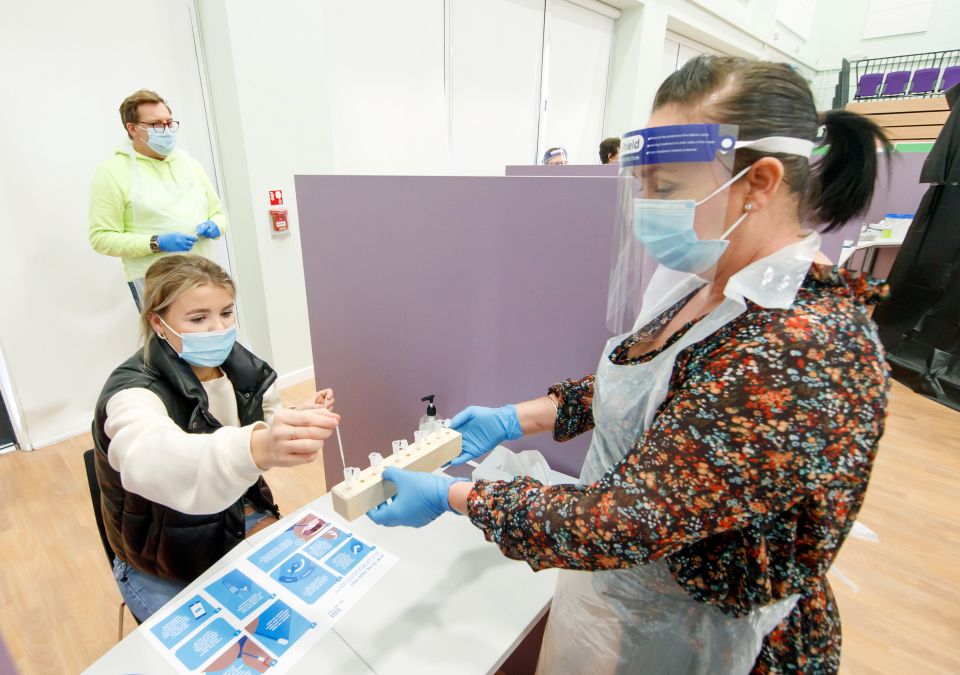 Student Ellie Fisher, left, takes a Covid test at Outwood Academy in Doncaster, ahead of schools and colleges fully reopening on Monday