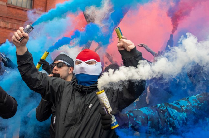 Rangers supporters set off smoke bombs in celebration outside Ibrox