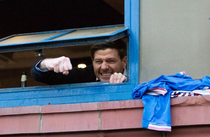 The gaffer Steve Gerrard showed his delight through a window