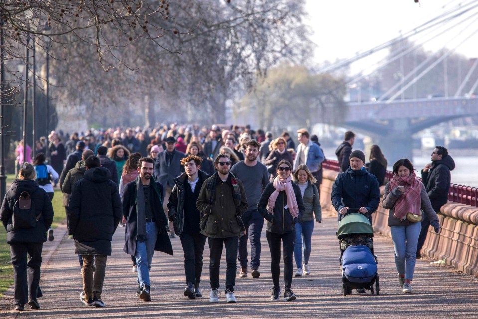 Covid cases in the UK continue to fall. Pictured: Walkers enjoy a stroll at Battersea Park in London