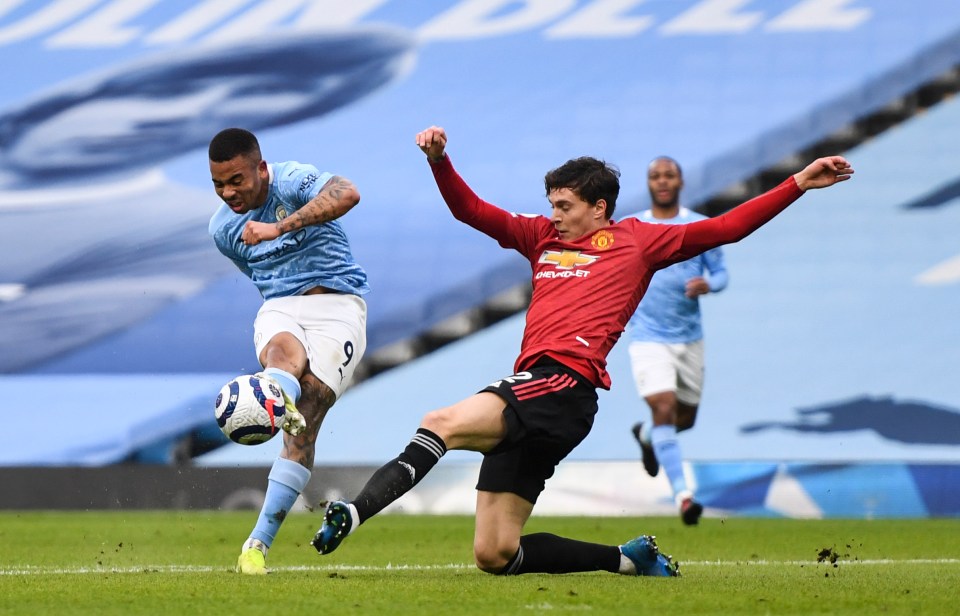 Gabriel Jesus curves in a shot as Man City tried in vain to battle back against United