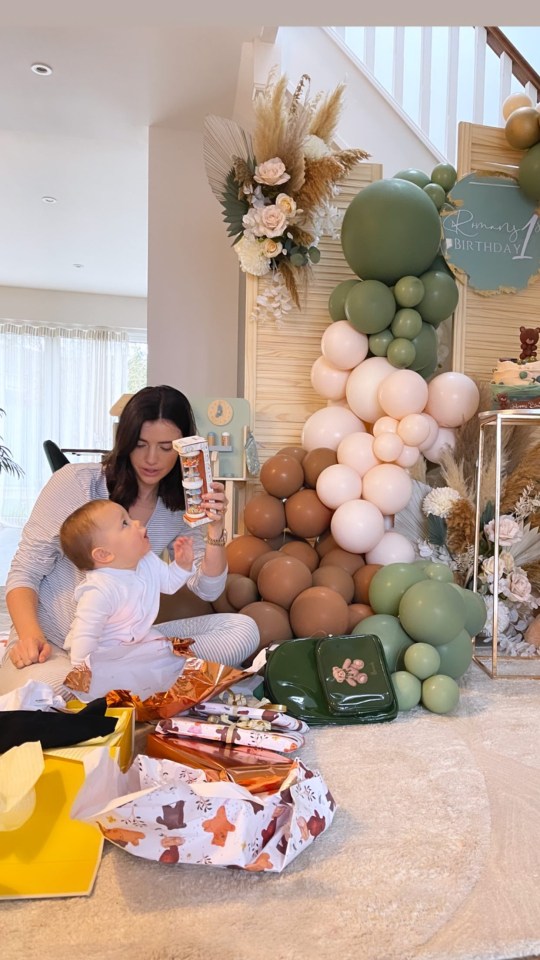 Lucy and Roman opening presents together