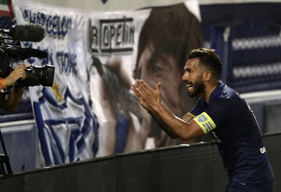 Carlos Tevez paid his respects to his late father after he scored in Boca Juniors' win against Velez Sarsfield