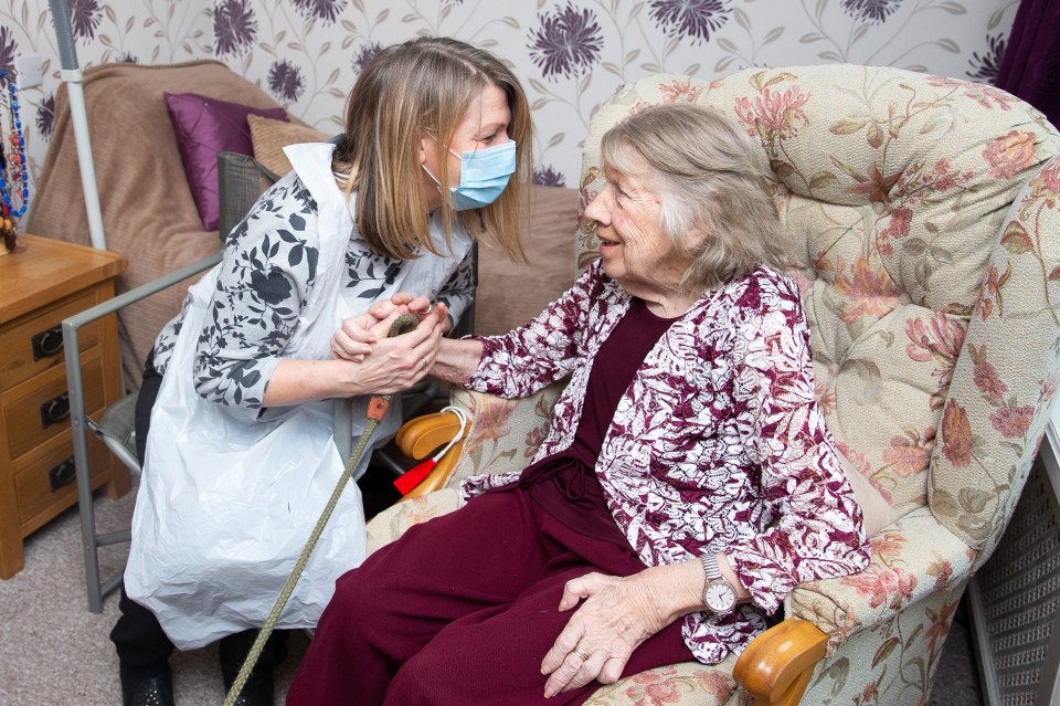 Melanie Grove sees her mother Barbara Baxter, 89, at Highcliffe Rest Home in Chorley, Lancs, on March 8, 2021