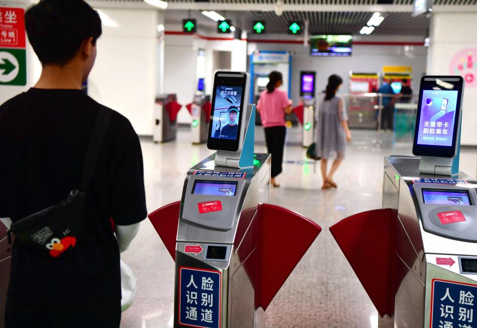 A citizen scans his face to go through a ticket barrier of a subway station in Fuzhou, in the Fujian Province of China