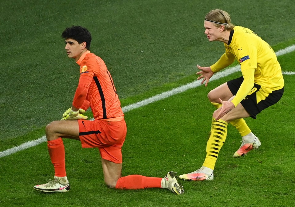 Erling Haaland roars back at Sevilla keeper Bono after converting the retaken penalty during the 2-2 draw, Dortmund winning 5-4 on aggregate