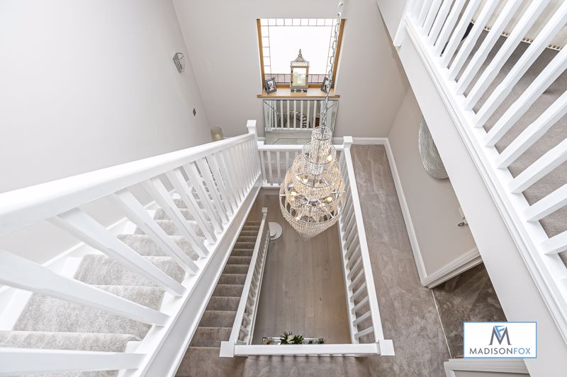 The three storey home features carpeted hallways and a plush velvest stair runner