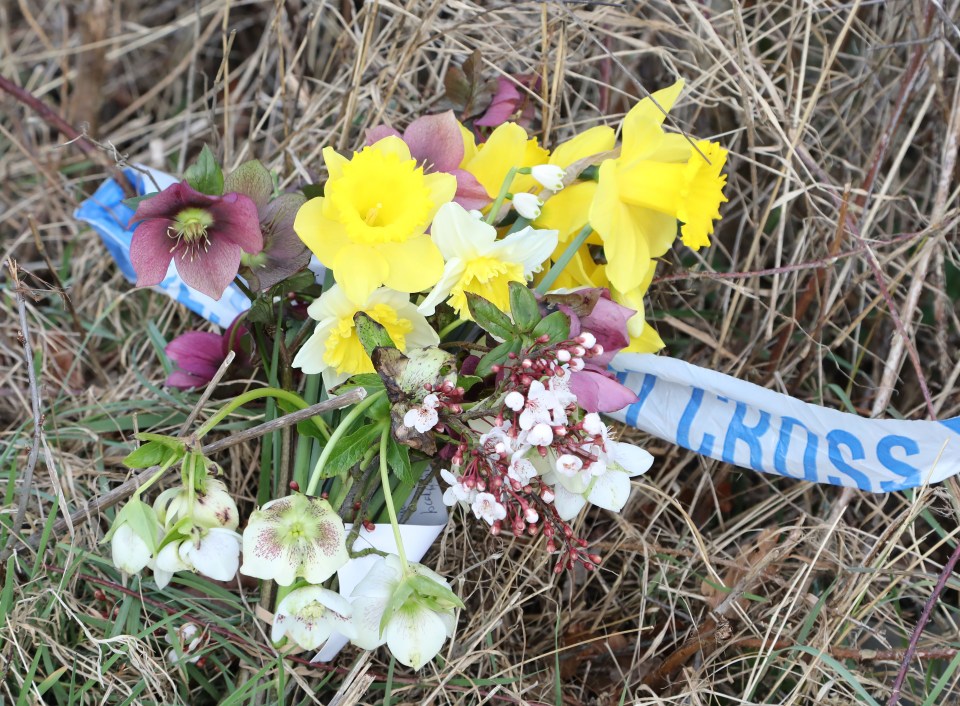 Flowers were left at one of the sites being searched