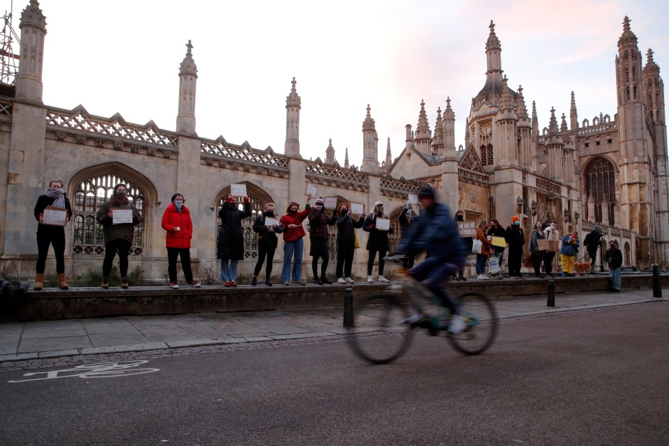 People attend a vigil for Sarah Everard, following her kidnap and murder, at King's Parade street in Cambridge