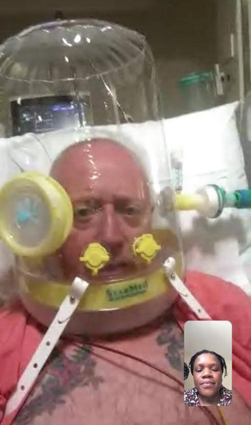 David Leahy pictured on a video call with his wife, Erica, while under an oxygen hood