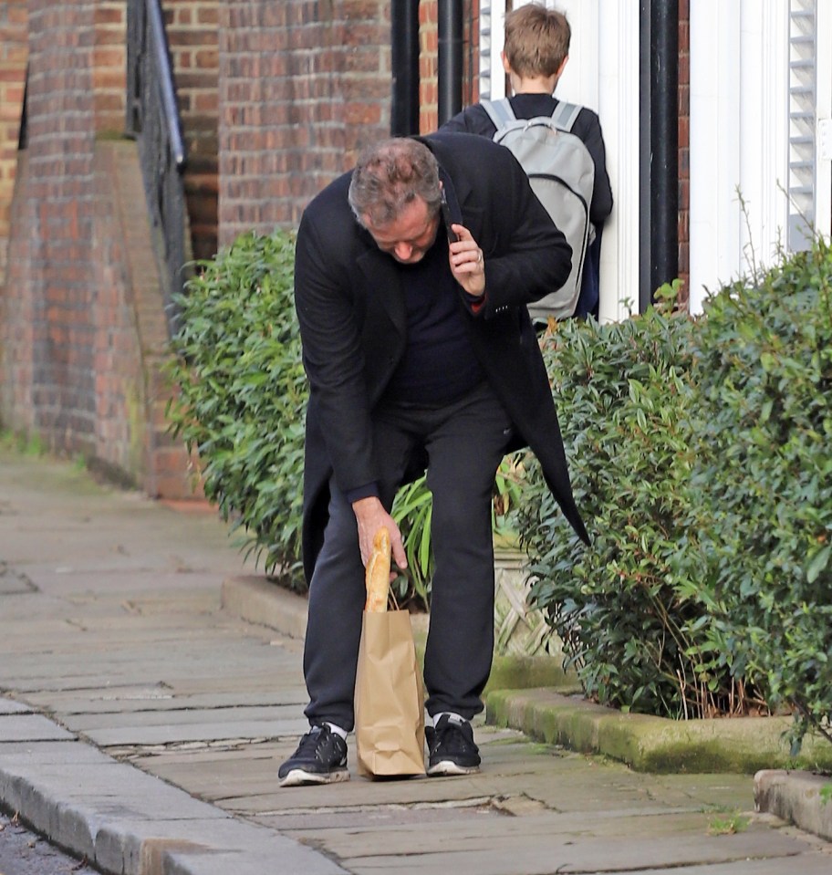 He wore a smart overcoat over his tracksuit and trainers