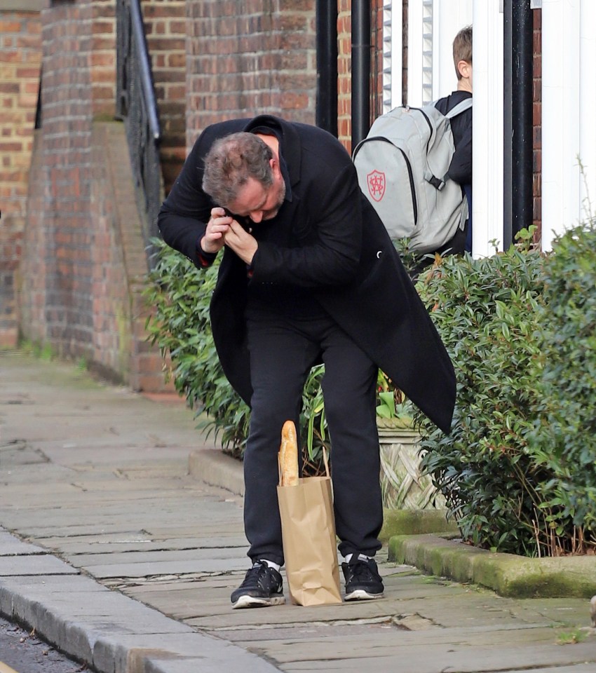 Piers chatted on the phone while checking on his shopping