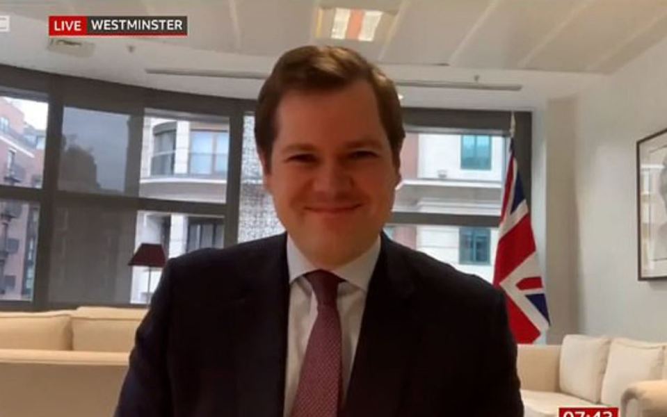 Housing Minister Robert Jenrick was spotted with a Union Jack behind him