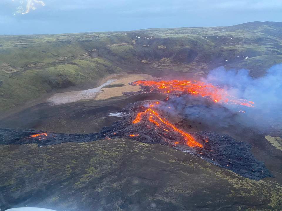 A picture taken by the Icelandic Coast Guard shows the lava flowing from the erupting Fagradalsfjall volcano some 40 km west of the Icelandic capital Reykjavik