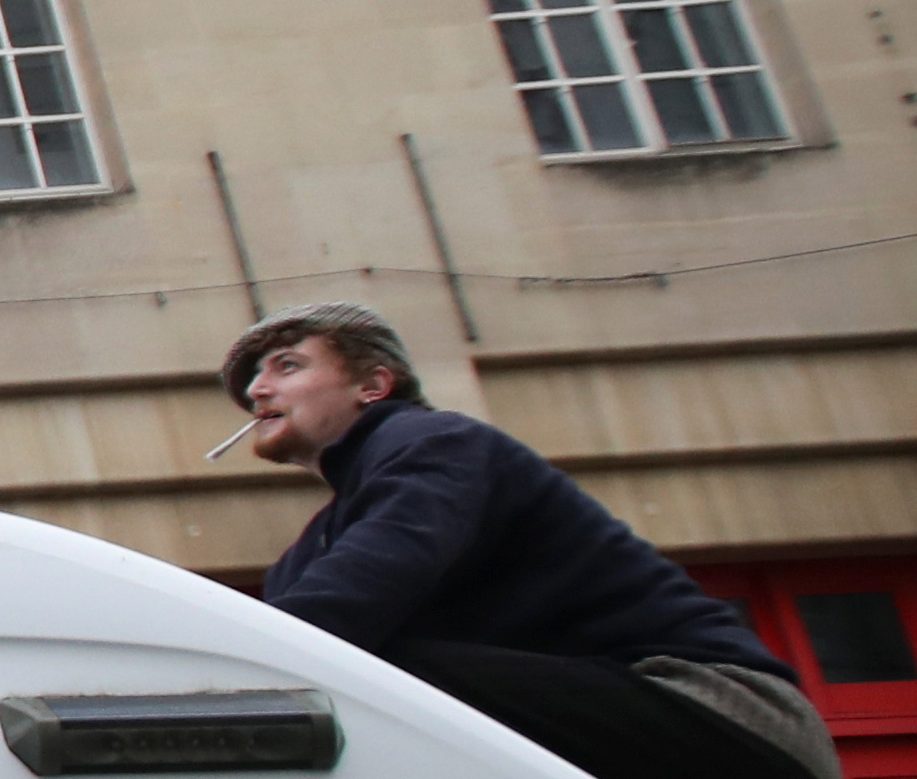 A smoking man photographed during the protest