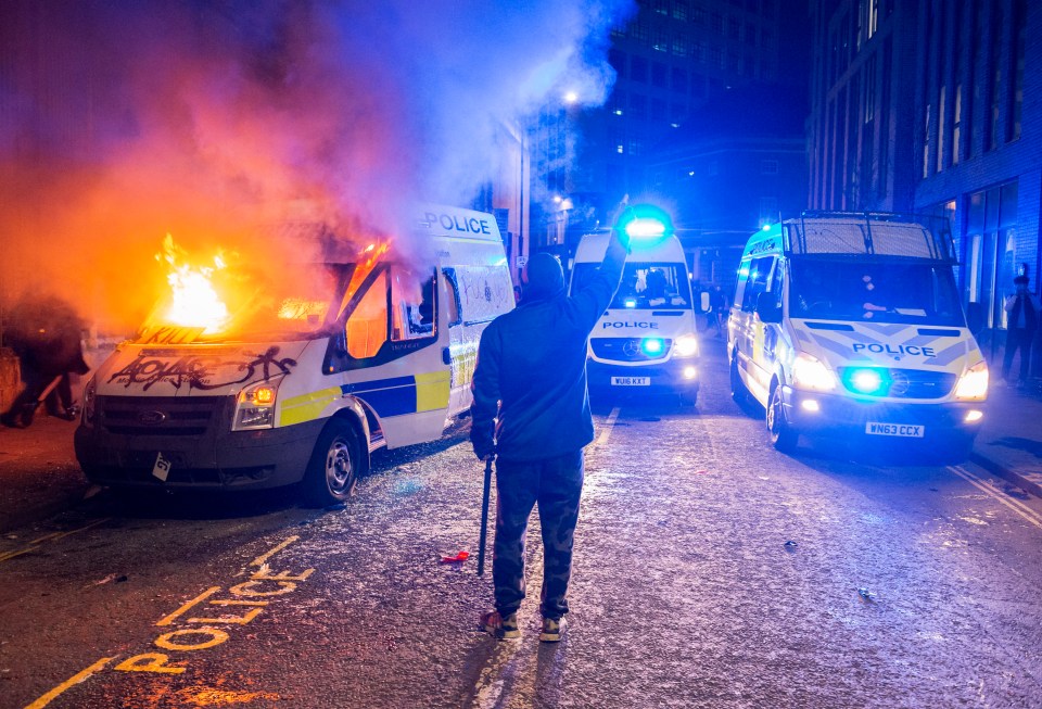 Rioters torched police cars and injured 20 officers in Bristol last night