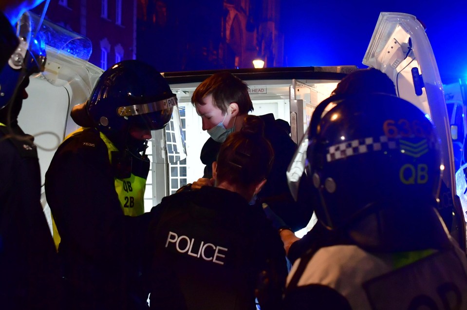 A protester is arrested by cops