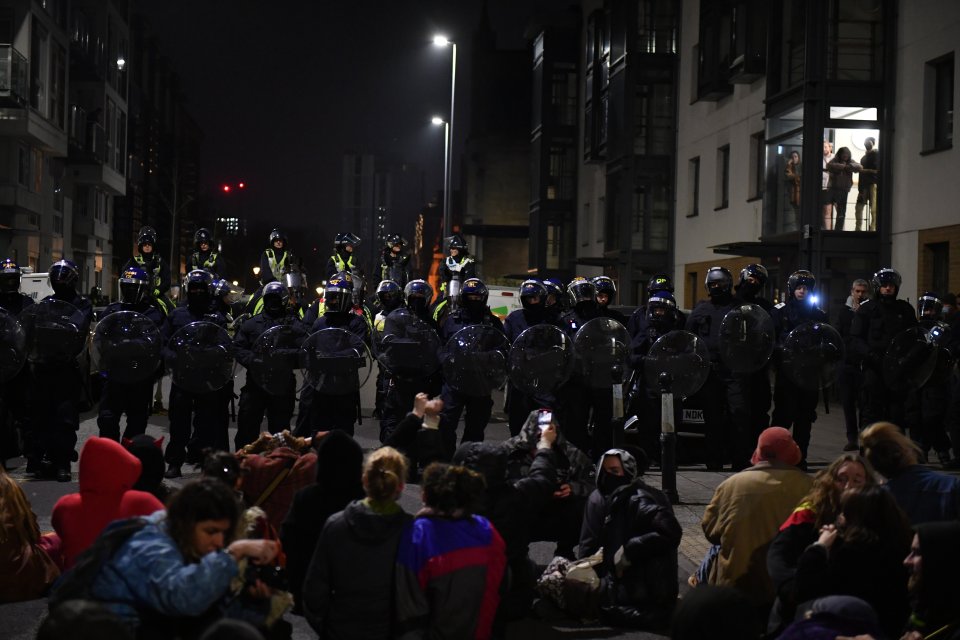 Riot cops locked in stand off with crowd of activists who refused to move