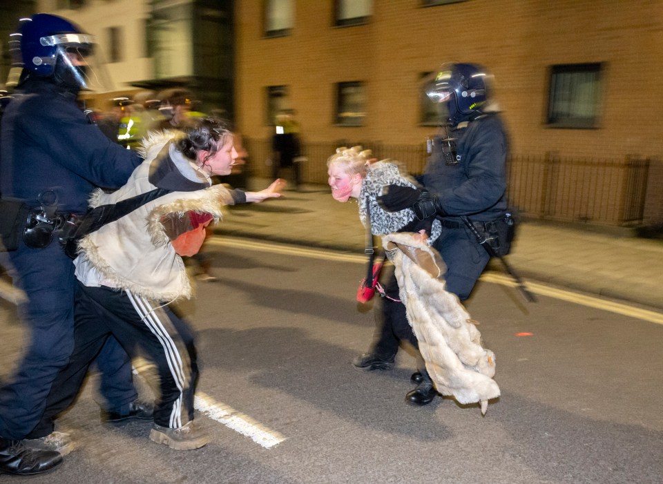 Two women protesters were removed from the scene